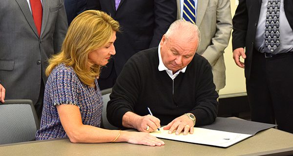 Walpole signs Community Compact with state