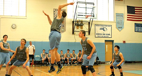 Medfield  boys volleyball splits home games