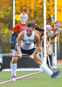 Christine Murray (11) gets ready to send the ball out to teammates on a penalty corner.  Photos by Tim Hoffman