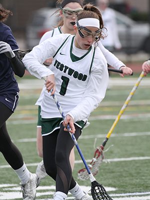 Westwood’s Kelly Doonan (1) focuses in to scoop up a ground ball.   Photos by Michael Mao