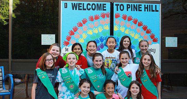 Sherborn Girl Scouts repaint Pine Hill doors