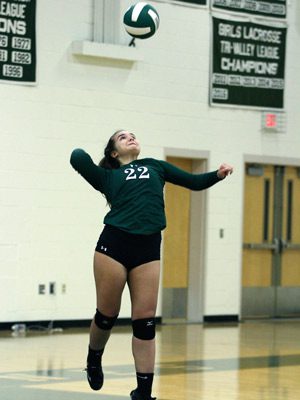 Sophomore Katya Vertiova (22) serves up one of her two aces on the evening against Millis on Monday. 