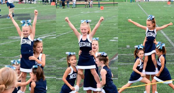 The 2nd and 3rd grade cheerleaders do a successful stunt on Sunday.