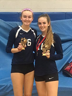 Jane Fanning and Siena Tacelli pose with their All-Tournament team selection awards after helping guide the Rockets to a 9-1 record at the Rhode Island Invitational on Saturday.  Photos by Twitter, @NeedhamGirlsVB