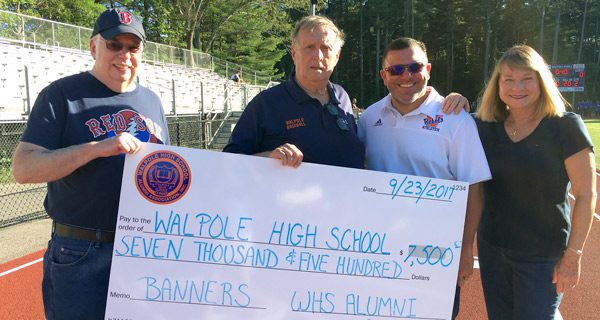 Alumni Association presents check to AD