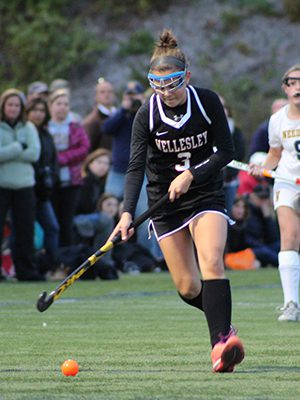 Kayla Johnston (3) moves the ball up the field for Wellesley midway through the second half.  Photos by Michael Flanagan
