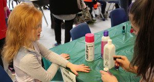 Second grader, Chloe O’Corcora gets her nails painted a sparkly purple at OPR’s annual Gingerbread Festival.