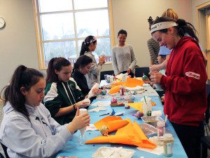After enjoying a few Mario Kart races, Westwood teens hang out with friends and create glittery unicorn ornaments at ‘Fri-YAY.’