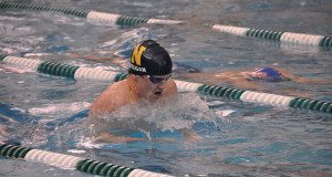 Junior Henry Keegan swims the medley relay