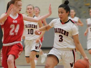 Gianna Palli (3) drives to the basket late in the fourth quarter. Photos by Michael Flanagan