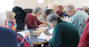 Seniors at the Westwood Council on Aging take part in ‘Brain Fit’ to discuss healthy brain aging and work on brainteasers.  Photos by Laura Drinan