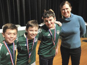 Fifth grade bee winners ‘Green Machine’ pose with bee moderator Allison Borchers, assistant superintendent of Westwood Public Schools.