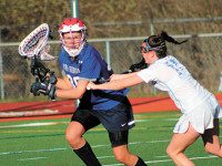 McCarthy, Lady-Warriors best Grosek, Raiders