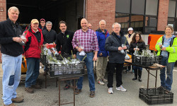 Rotarians distribute saplings to students