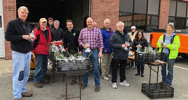Rotarians distribute saplings to students