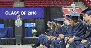 Makenna Woodward-Crackower addresses her fellow classmates as Needham High’s class of 2018 prepares to turn their tassels. Photos by Laura Drinan 