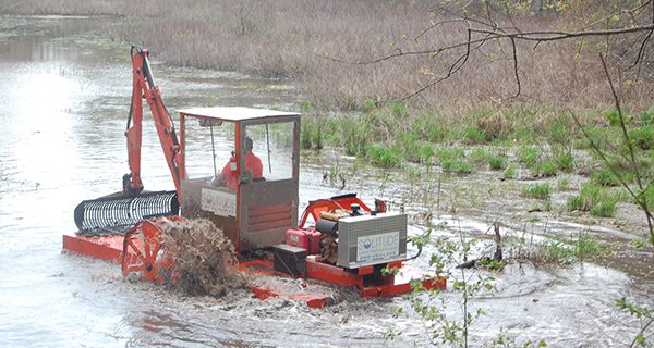 Hydro-raking cleans Perry Crouse Pond