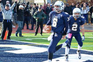 Before his time at Northeastern, Jake Farrell (6) was a star quarterback at Xaverian and helped the Hawks to the Division I state championship his senior season in 2014. Photos by Xaverian Brothers High School and Northeastern Athletics