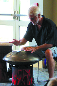 Craig Norton playing one of his many different drums after telling a story to the kids. Photos by Daniel Curtin