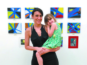 Daniela Rivera and daughter Mila with the Yellow Room’s bird-inspired canvases.