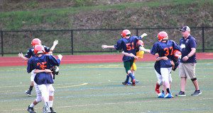 Walpole Youth Football players learn the proper way to tackle.