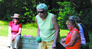 With her game face on, one of Dover’s bocce players readies her next shot.