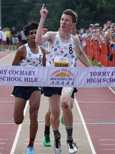 John Mariano (8) points to the sky in celebration as the Xaverian rising-senior crosses the finish line in first place at the Tommy Cochary High School Mile on Saturday in Falmouth.   Photos by Falmouth Road Race