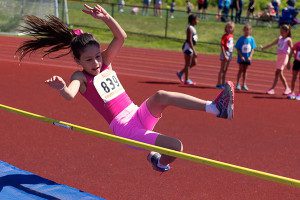 April Padilla Hrones (839) has a go at the high jump.