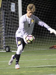 Senior keeper Will Popper (pictured) boots the ball up the field late in the first half. 