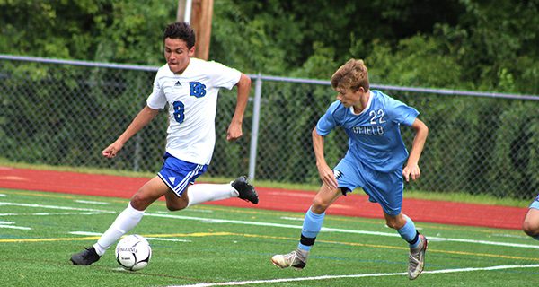 DS’s Adam Fam (8) attempts to escape from Medfield’s Jake Sherman (22) midway through the first half.