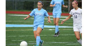 Sophomore midfielder Marissa Gorog (pictured) attempts to wiggle her way around a Medway defender late in the first half.