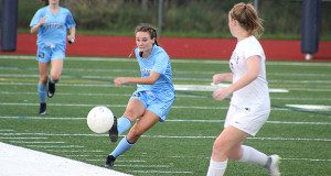 Ainsley Marshall (pictured) who logged Medfield’s lone goal of the night, boots the ball up the field midway through the first half.