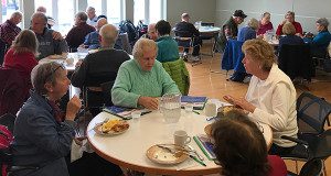 Senior citizens enjoy their monthly breakfast at the Center at the Heights.