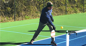 Sherborn resident Kelly McClintock hits the ball back during a practice session of pickleball. 
