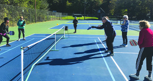 Pickleball instructor Ruane Crummet hits the ball back-and-forth with the creator of the group, Paige Brodie.