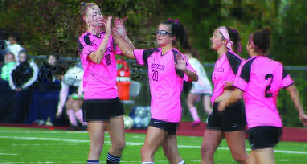 Girls soccer rolls on Pink Day