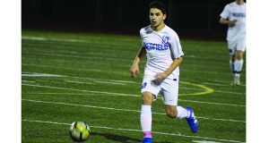 Saul Lacerda (10) pursues a loose ball for Medfield.