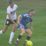 DS’s Mica Bodkins (2) attempts to navigate around Wellesley’s Brooke Baker (1) late in the first half. 