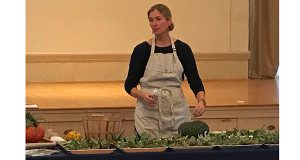 Deborah Trickett shows members of the Garden Club how to glue succulents to pumpkins during her workshop.