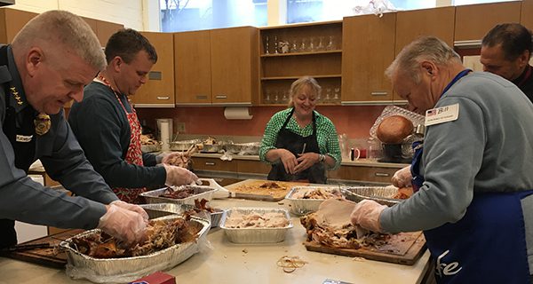 Volunteers lend a hand during the Thanksgiving luncheon at the Dover Church.