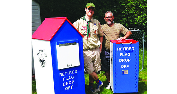 Eagle Scout Corriveau installs flag drop boxes