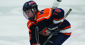 Pictured last season against Wellesley, senior captain Meghan Hamilton (16) will serve as a top-line center for Walpole High girls hockey this season and help guide the Lady-Rebels back to the state tournament.