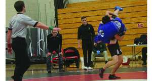 A textbook takedown from Wellesley as coach AJ Grignaffini looks on.
