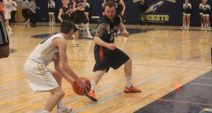 Needham’s Kyle Sullivan, who was praised for his rebounding, shows off his ball handling.