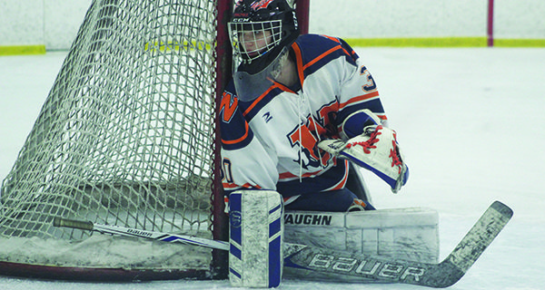 Senior goalie Kiera McInerney (pictured) hugs the post and keeps an eye on the play down in the corner. 