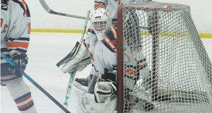 Sophomore goalie Jack Curran (1) hugs the post and keeps an eye on the play down in the corner.Photos by Michael Flanagan