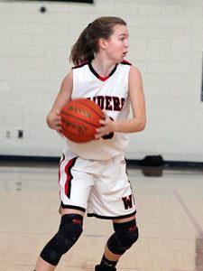 Senior captain Molly Cronin (pictured) scouts the scene and gets ready to make a cut to the basket.   Photos by Michael Flanagan