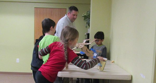 Young inventors make grabbers at library
