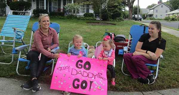 Some of the many supporters who spent the road race cheering on runners.