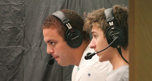 From their booth, Conner and Ware commentate on the action.